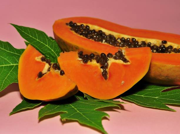 istock Papaya fruit isolated on pink background 1250651438