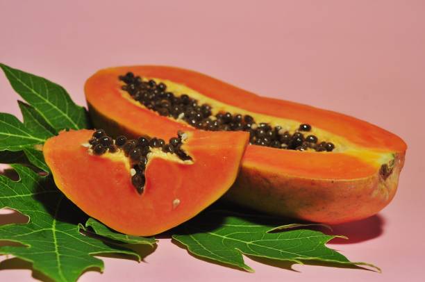 istock Papaya fruit isolated on pink background 1250651502