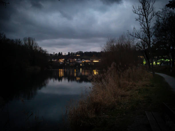 Dusk over river and residential district. Reflection on surface Aare river.