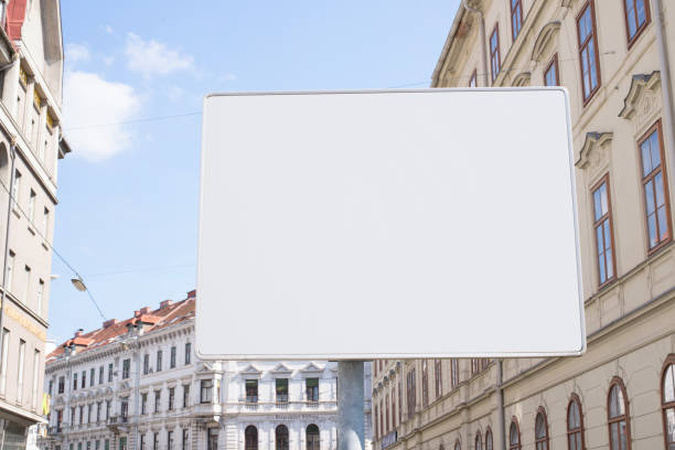 istock Blank street signpost for adding text. City buildings in background 1250653950