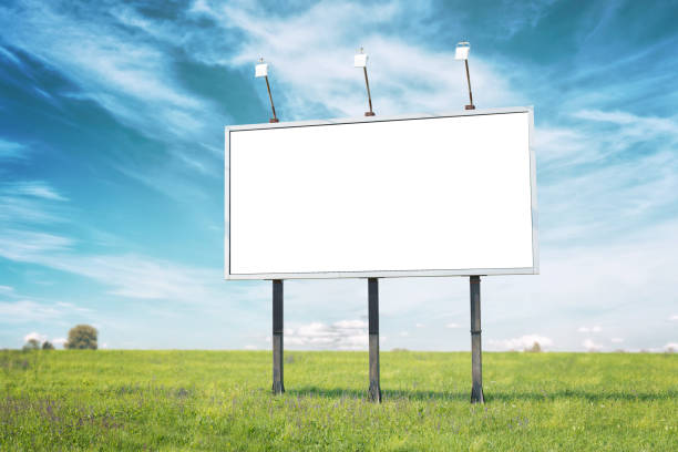 istock Billboard mockup on meadow. Isolated surface in white for marketing campaign promotion 1250653953