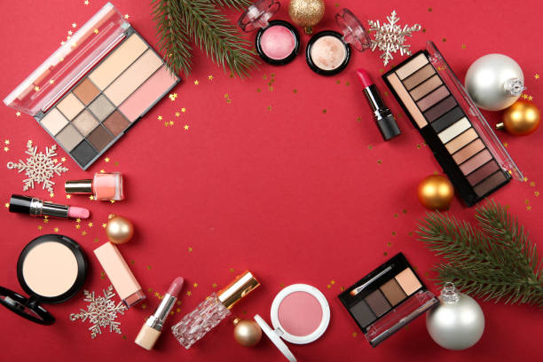 istock Beautiful composition with Christmas decor and makeup cosmetics on a colored background top view. 1250655164