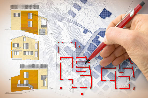 istock Architect drawing a new residential building over an imaginary cadastral map of territory 1250657256