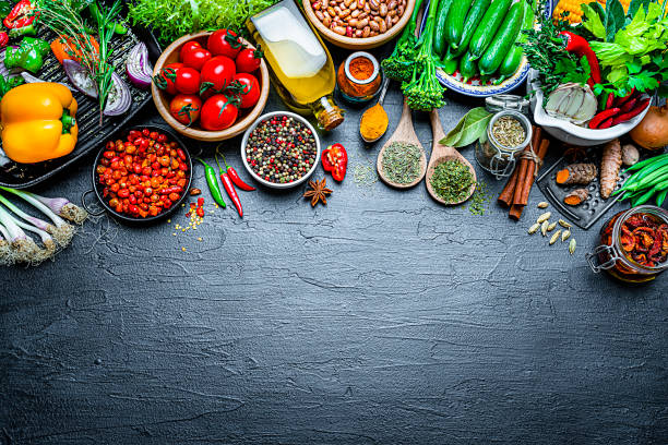 istock Cooking backgrounds: vegan ingredients frame on black background with copy space 1250659385