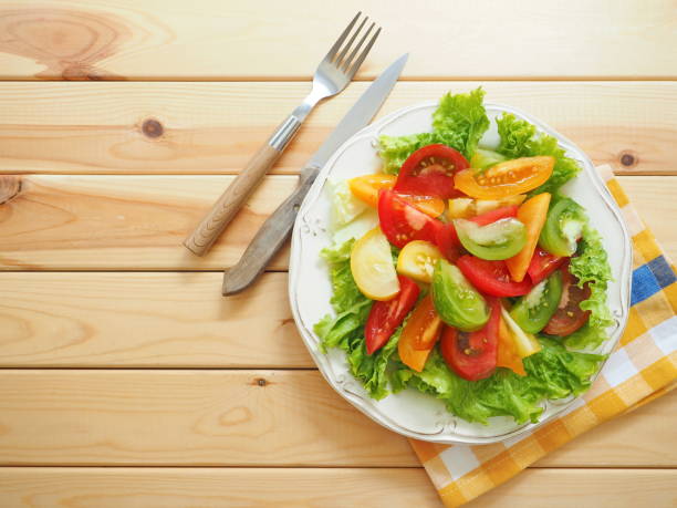 istock Fresh salad made from colored tomatoes - yellow, red, green and orange 1250659763