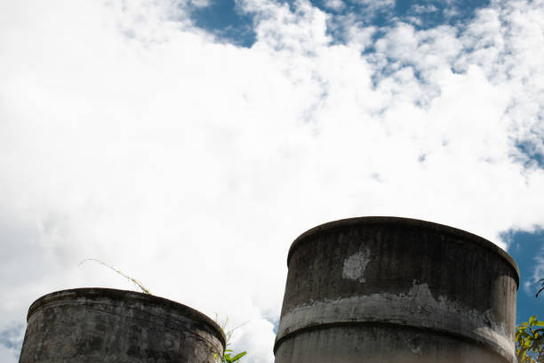 istock old concrete tank with white fluffy cloud 1250662438