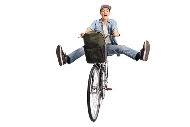 istock Happy guy riding a bicycle and spreading legs 1250665453