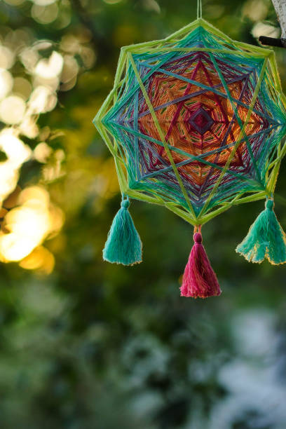 istock Woven bright yarn mandala outdoors in park 1250667019
