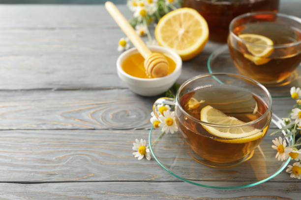istock Composition with chamomile tea on gray wooden background 1250668841