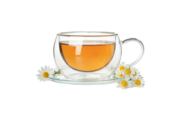 istock Glass cup of chamomile tea isolated on white background 1250668923