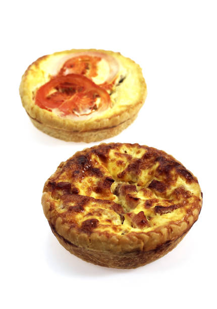 istock Leek Quiche and Tuna Quiche with Tomatoe against White Background 1250669042