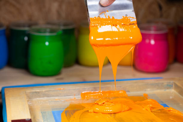 orange color dripping from hand screen printing