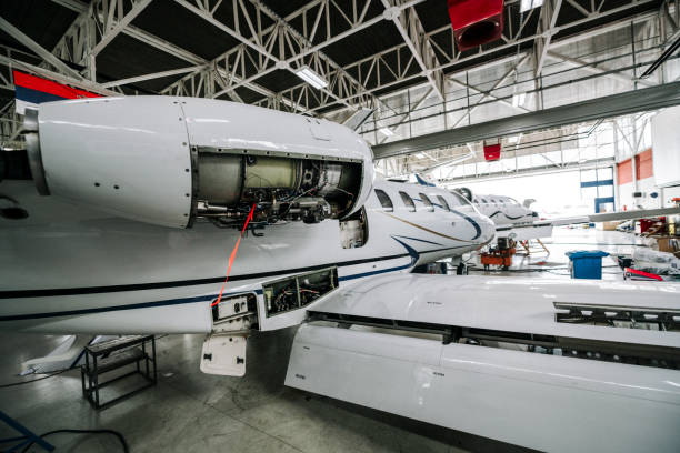 istock A small private plane with a jet engine cover removed in a repair hangar 1250672643