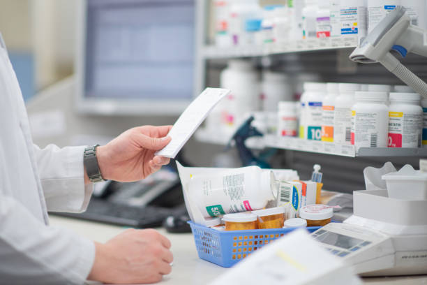 istock Filling out prescriptions at the pharmacy 1250674244