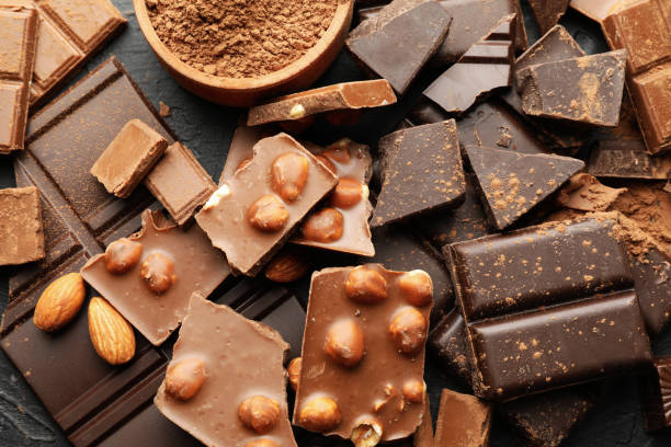 istock Chocolate, melted chocolate and almond on black background 1250676306