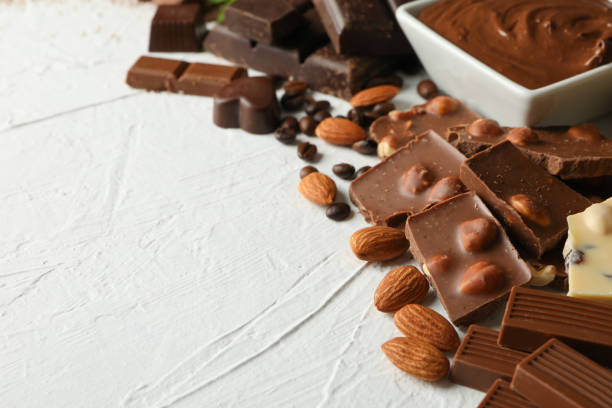 istock Chocolate, melted chocolate, coffee and almond on white background 1250676920