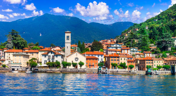 idyllic scenery of beautiful lake lago di como, torno village. lombradia, italy - tourist resort lake italy scenics imagens e fotografias de stock