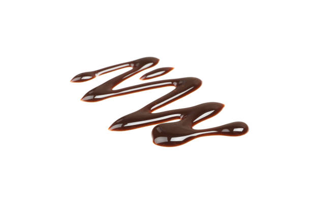 istock Tasty melted chocolate isolated on white background 1250677325
