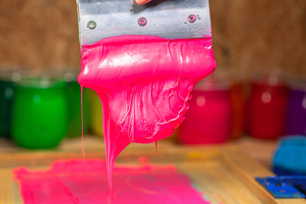 istock pink color dripping from hand screen printing 1250679369