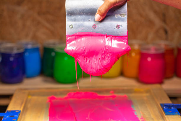 istock pink color dripping from hand screen printing 1250679425