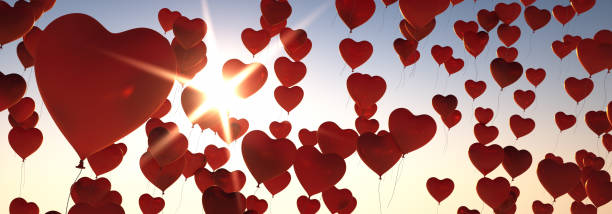 istock Many Balloons Flying to the blue sky with sunlight 1250680652
