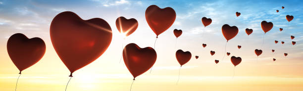 istock Many Balloons Flying to the blue sky with sunlight 1250680688