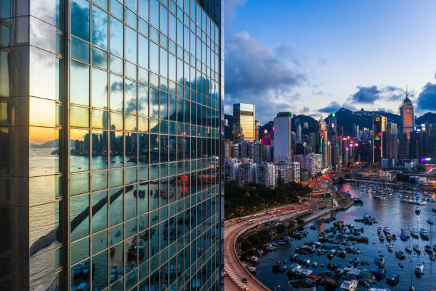 modern office building detail, glass surface - hong kong city urban scene building exterior imagens e fotografias de stock