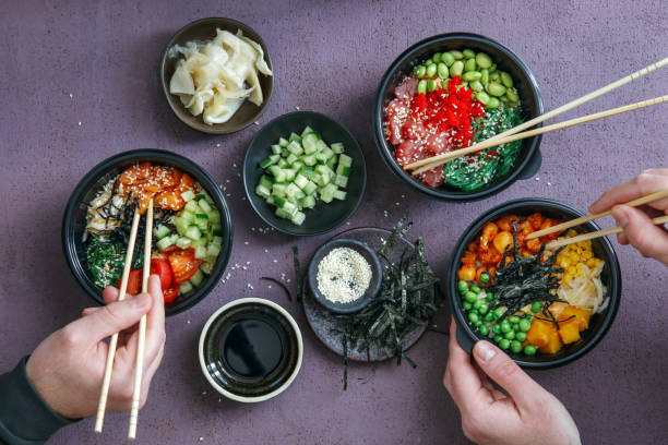 istock Family Eating Takeaway Poke Bowls 1250682421