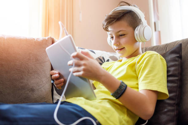 istock Kid resting at home over digital tablet 1250685599