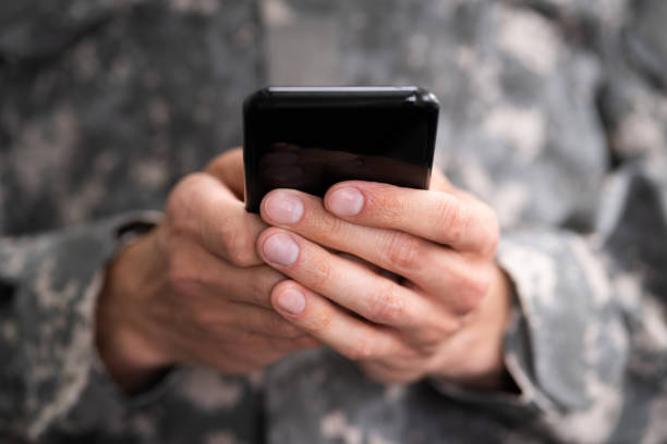 istock Social Cyber Warfare. Army Soldier Using Phone 1250690146
