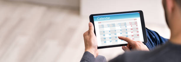 istock Male Looking At Calendar 1250690217