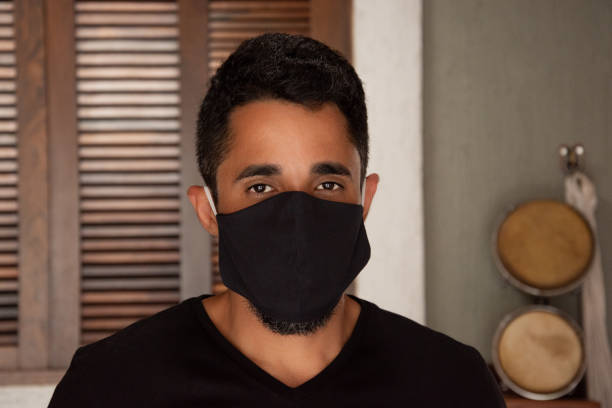 istock Man with coronavirus protection mask 1250690357