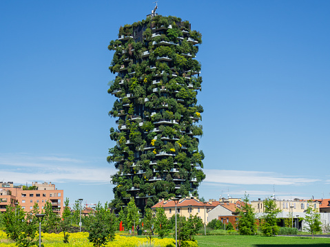 Milano, Italy. Bosco Verticale, view at the modern and ecological skyscraper with many trees on each balcony. Modern architecture, vertical gardens, terraces with plants