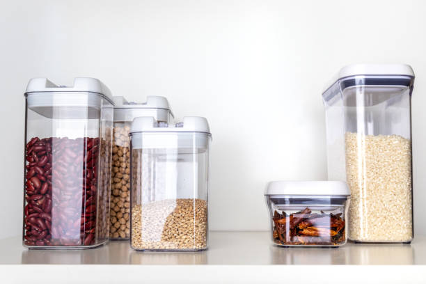 Clear Pantry Containers Clear Pantry Containers Filled with Non-Perishable Foods, including Dried Beans and Grains airtight photos stock pictures, royalty-free photos & images