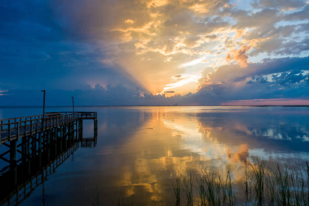 istock Vibrant sunset at Mobile Bay 1250702534