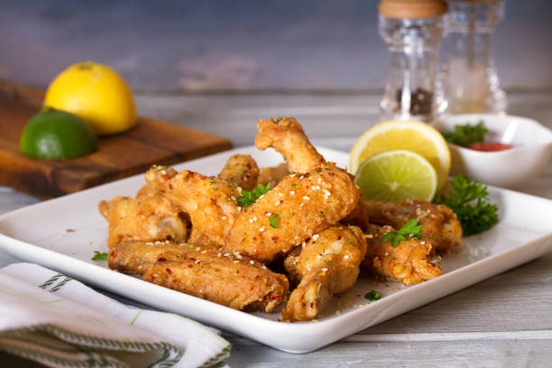 istock Crispy chicken wings with lemon and sauce 1250703471