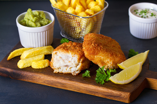 Traditional fish and chips with mushy peas