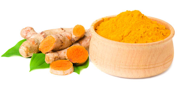 istock Turmeric powder with turmeric root isolated on white background 1250705091
