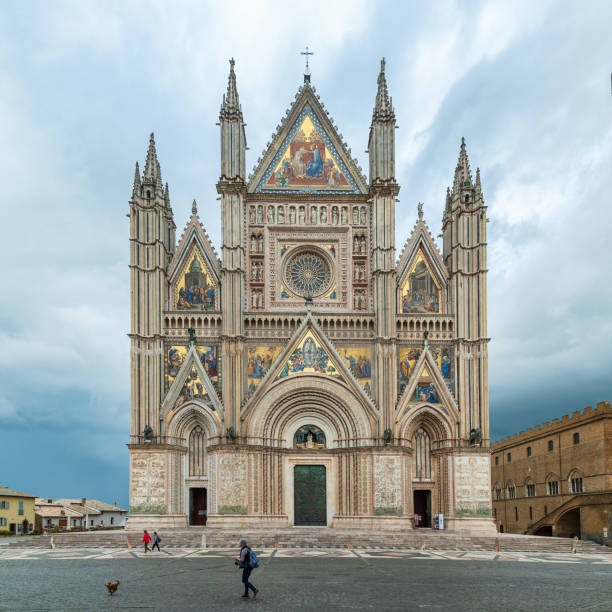 Orvieto, Italy - June 11, 2020:  Cathedral of Santa Maria Assunta visited by pilgrims and tourists from all over the world,