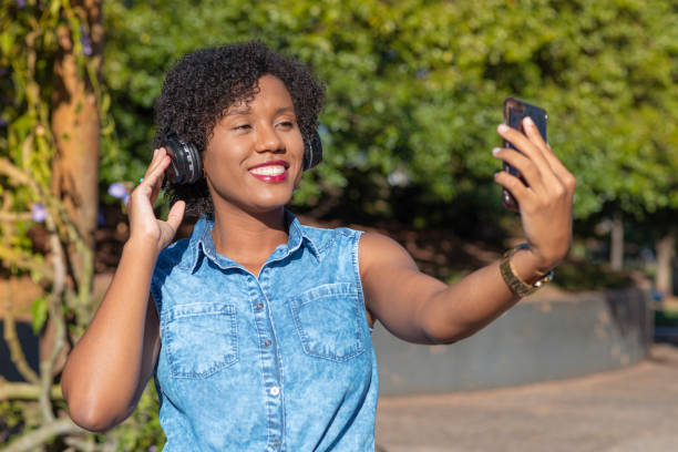 istock Young woman taking selfie with cellphone 1250713118