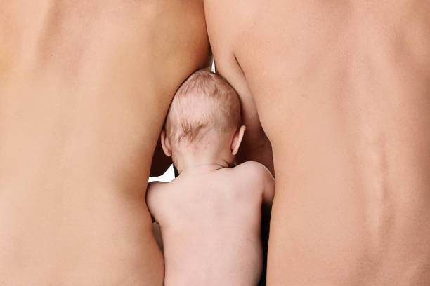 istock Family unity concept. Parents with baby, back 1250717764