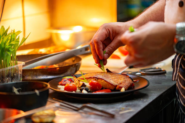 istock Chef finishing delicious meal at the restaurant. 1250720880