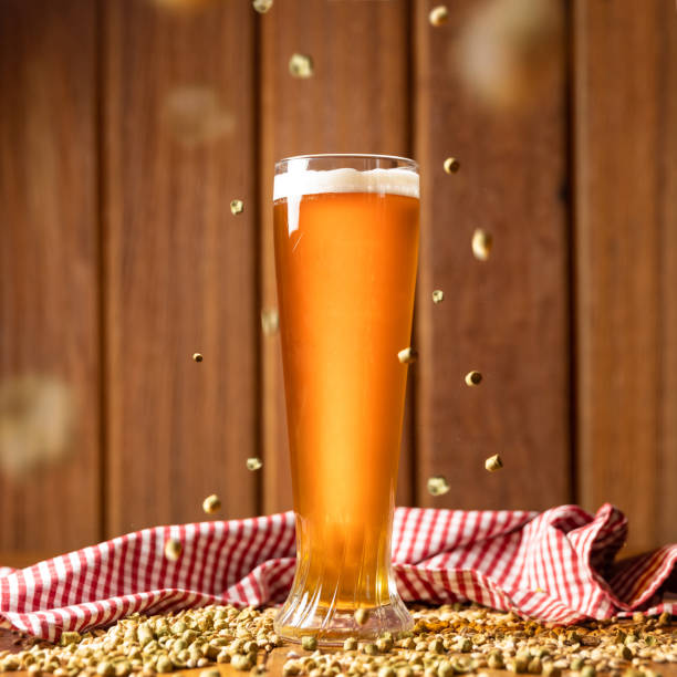 istock Beer glass with flying malted barley 1250721102