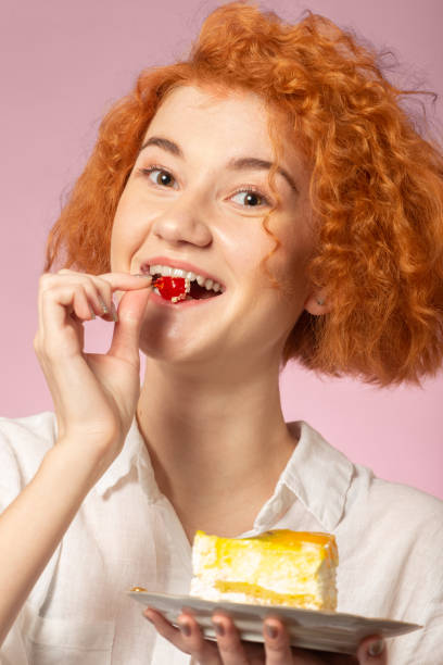 istock girl eats sweet dessert 1250721104