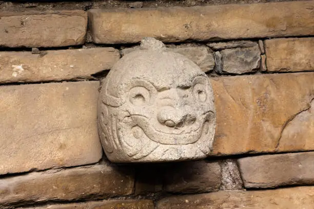 Photo of Art on stone, head nailed to the temple of Chavin of Huantar.