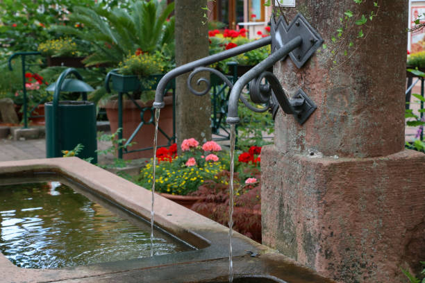 istock Old Well / Water runs from an old well 1250726608