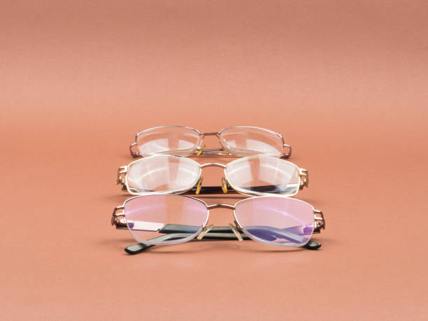 istock Glasses - an accessory for better vision on a brown background. 1250726988