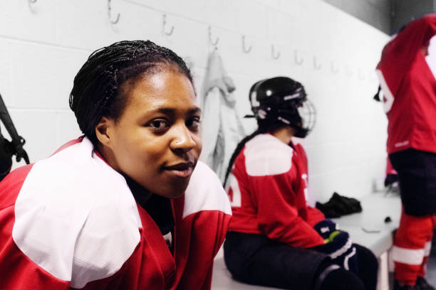 istock Woman's Hockey Team in a Locker Room 1250729397