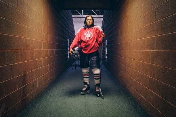 istock Woman Hockey Player 1250729456