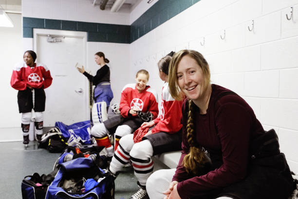 istock Woman's Hockey Team in a Locker Room 1250729534